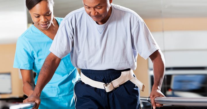 nurse helps man in a walker - five steps to stroke recovery mercy health