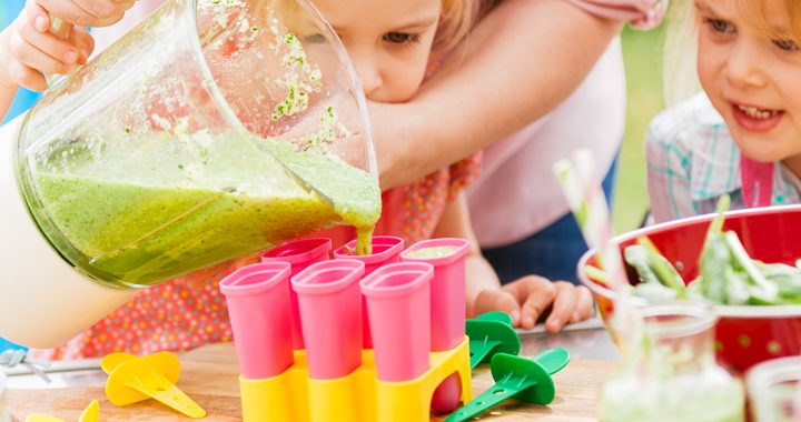 mom helps kids make green smoothie popsicles _ ways to get your kids to eat more vegetables