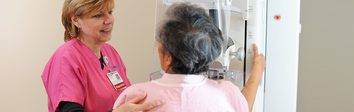 patient and health care worker talking during mammogram