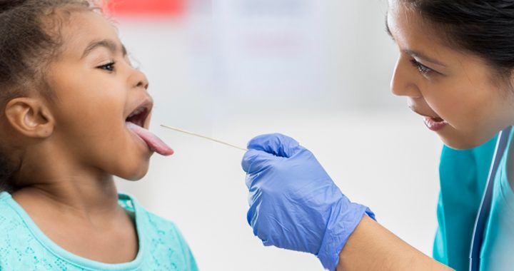 physician tests female child for strep throat