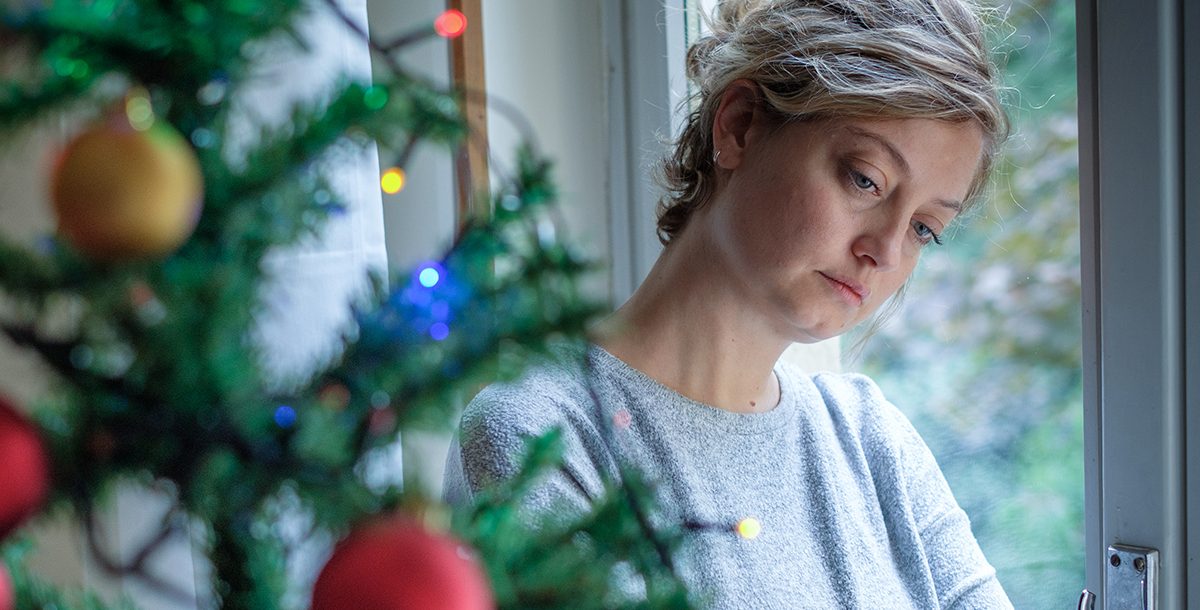 A woman grieving during the holidays