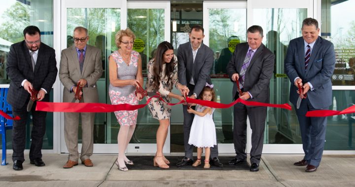 The Bitar family and other staff cut a red ribbon to open the doors of the Bitar Medical Center