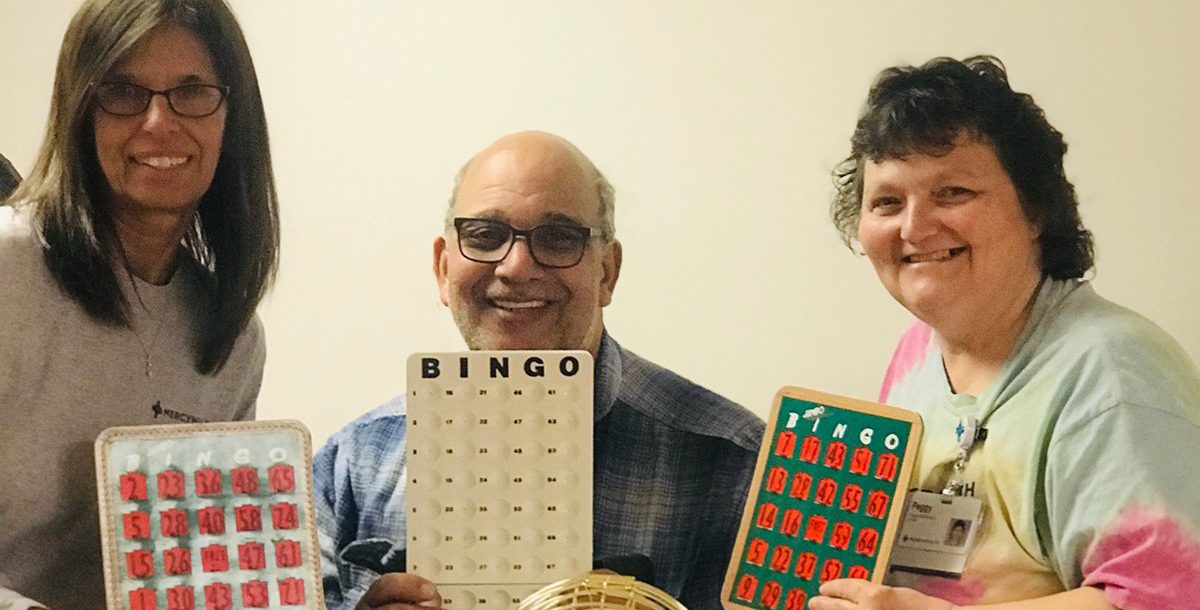 Tonya West with coworkers playing hallway bingo during COVID-19.