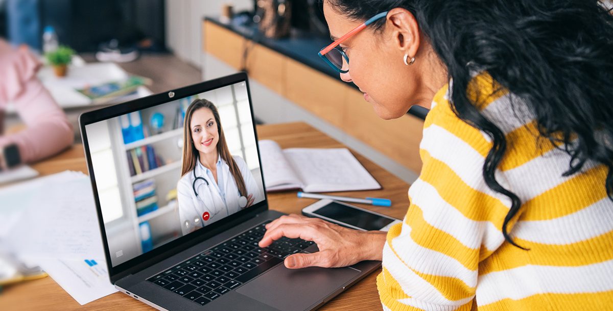 A millennial participating in a video visit with her primary care provider.