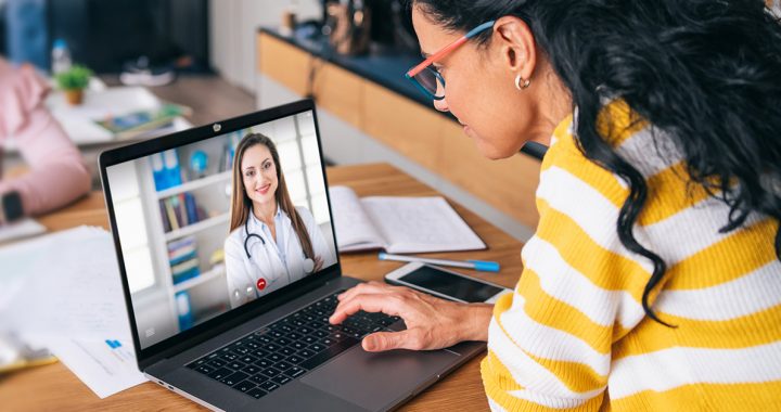 A millennial participating in a video visit with her primary care provider.