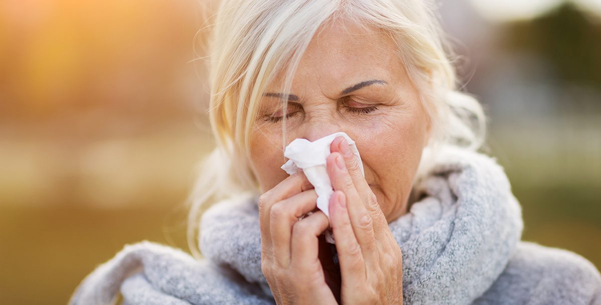 A woman experiencing fall allergies.