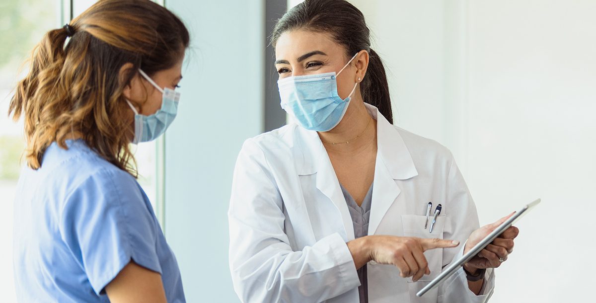 A patient meeting with a doctor about a colon cancer screening.