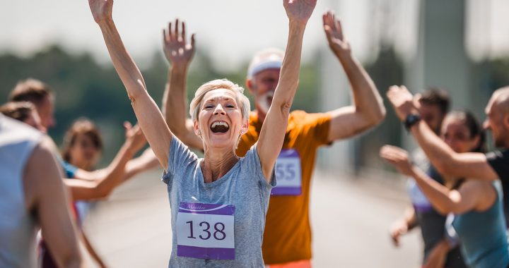 A woman crossing the finish line of a race.