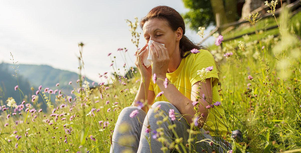 A woman experiencing spring allergies