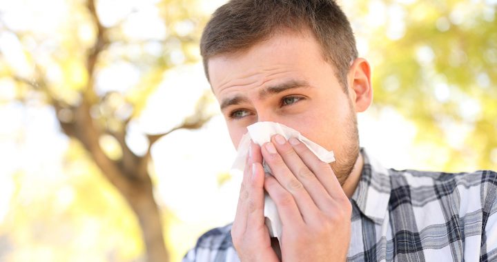 A man experiencing seasonal allergies.