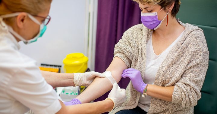 A woman donating blood.