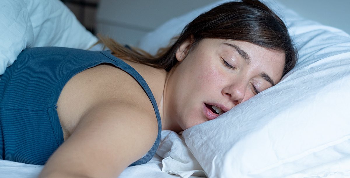 A person mouth breathing while sleeping.