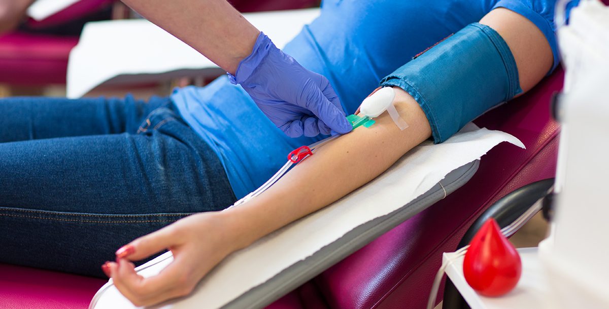 A person donating blood.