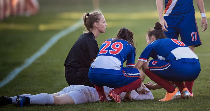 A student soccer player suffering from an injury.