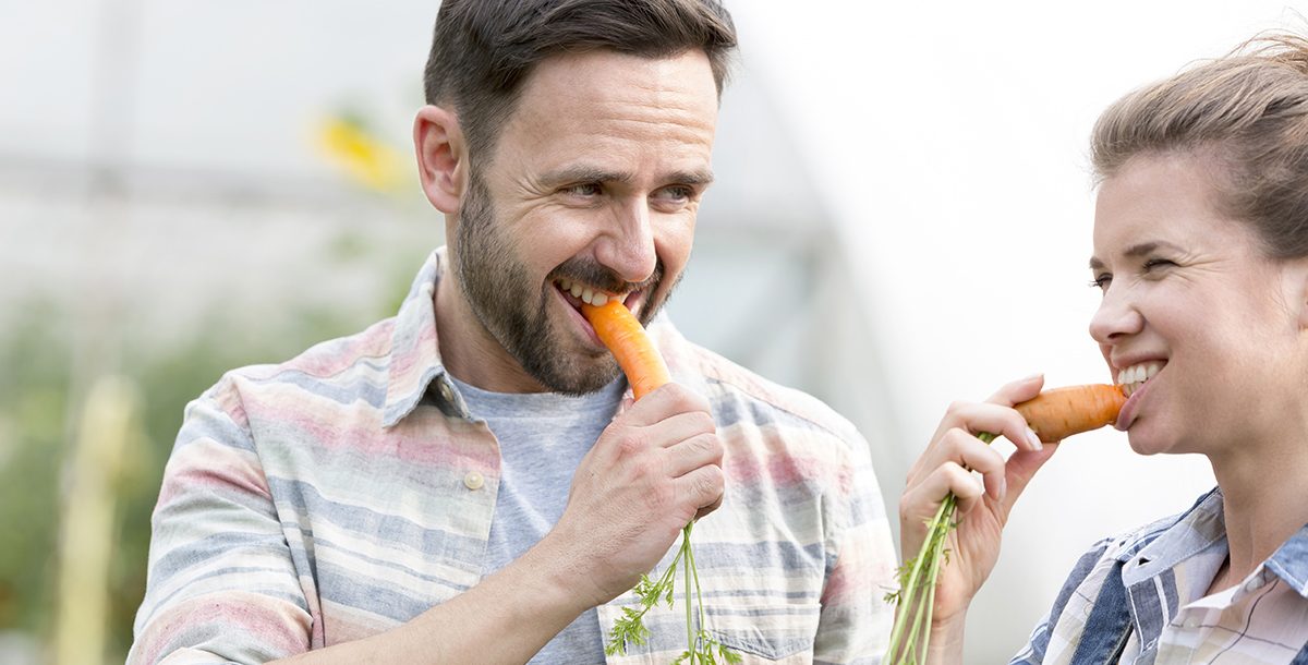 a person eating carrots
